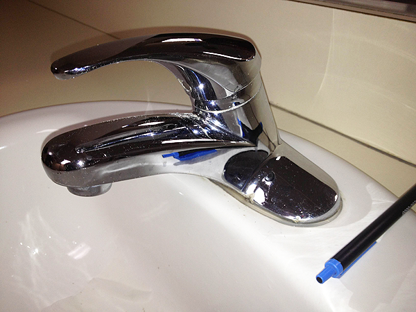 bathroom sink and chrome fixtures installation